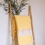Plaid à franges, en coton jaune et écru, motifs chevrons